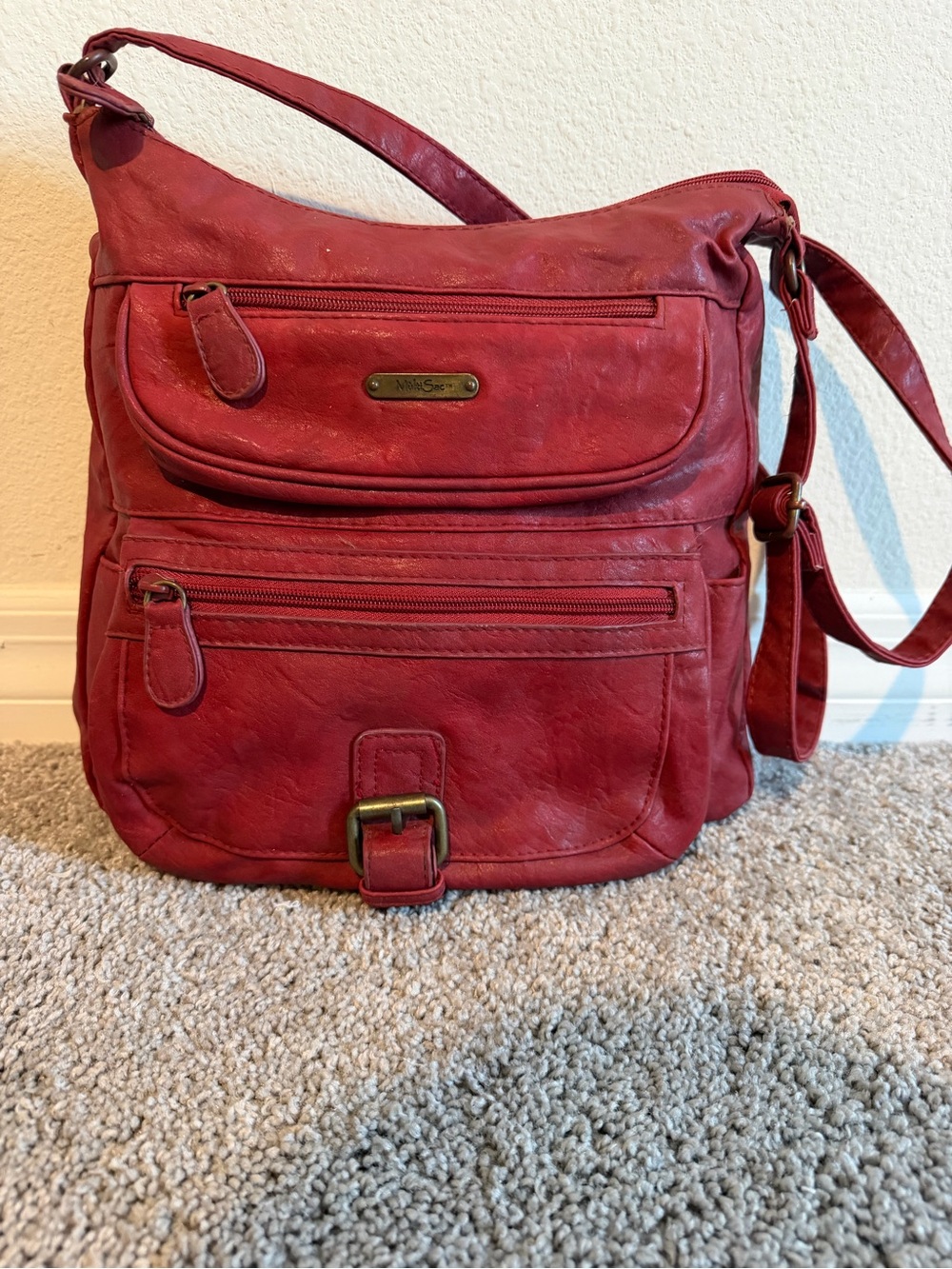 Stylish Red Crossbody Bag with Front Pocket Detailing